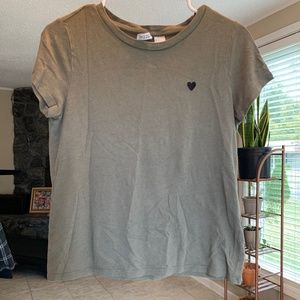A women’s small green cropped shirt.